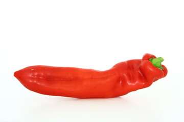 Fresh vegetables - red long sweet pepper on white background - healthy food