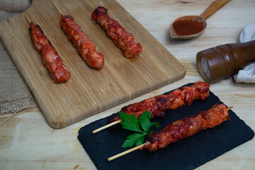 Pinchos morunos  or meat skewer. Typical Spanish cuisine dish made with pork or chicken carn marinated with garlic and paprika