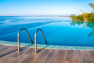 Obraz na płótnie Canvas Infinity Edge Swimming Pool Water, Beautiful Black Sea View.