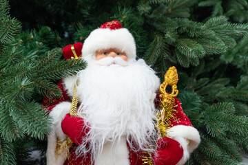  Christmas toys and Santa Claus are on the shelves in the store of holiday goods.