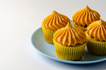 Pumpkin cupcakes with pumpkin-caramel cream Isolated on a White Background