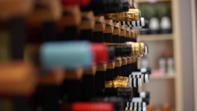 wine bottles in a large rack in a wine cellar