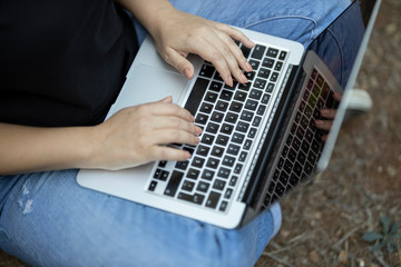 Fototapeta premium a woman working with laptop