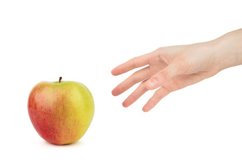  Woman's hand reaches for an red green apple on a white background