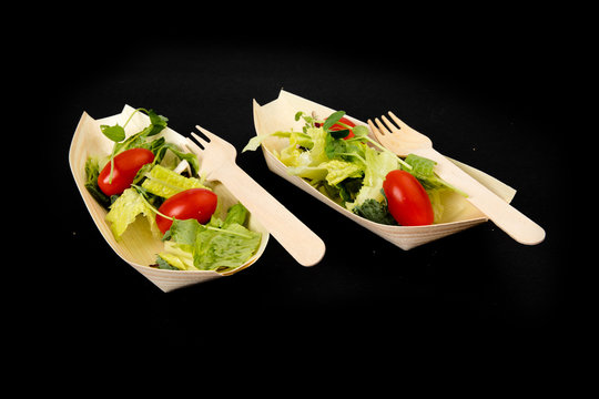 Sustainable Compostable Bamboo Disposable Bowls And Forks With Various Food Items  Isolated