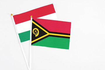 Vanuatu and Hungary stick flags on white background. High quality fabric, miniature national flag....