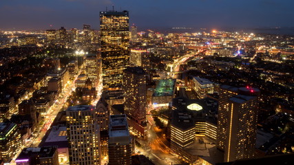 a night time view of boston's financial district from the observation deck of skywalk in boston