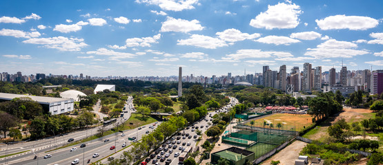 View of Ibirapuera Park, obelisk and building of the Sao Paulo city  in sunny afternoon. Brazil.