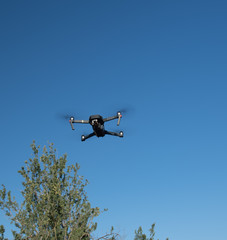 A close up of a drone hovering