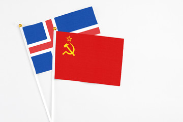 Soviet Union and Iceland stick flags on white background. High quality fabric, miniature national flag. Peaceful global concept.White floor for copy space.