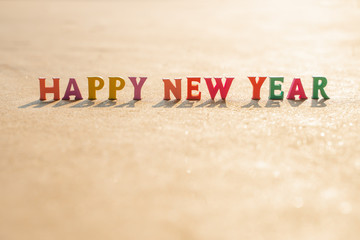 Happy New Year with many wooden letters..shallow focus effect.