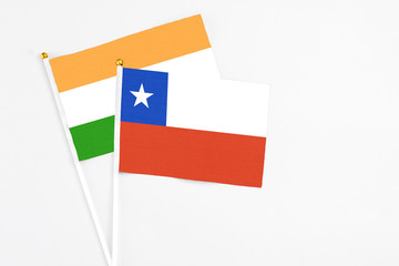 Chile and India stick flags on white background. High quality fabric, miniature national flag. Peaceful global concept.White floor for copy space.