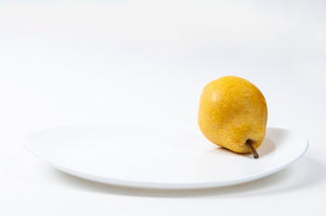 One pear on a plate