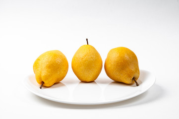 Three yellow pears