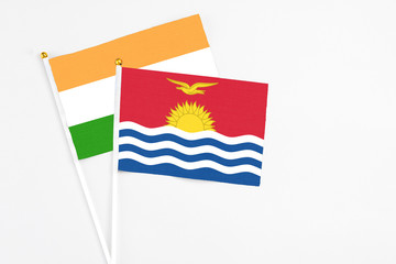 Kiribati and India stick flags on white background. High quality fabric, miniature national flag. Peaceful global concept.White floor for copy space.