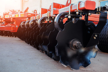 Working parts of new modern agricultural disc harrow for tillage