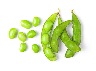 Green soy beans on white background top view.