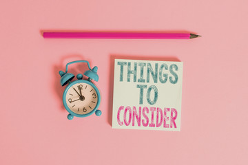 Word writing text Things To Consider. Business photo showcasing list to check or do it Shopping Schedule Time table Metal vintage alarm clock wakeup blank notepad marker colored background