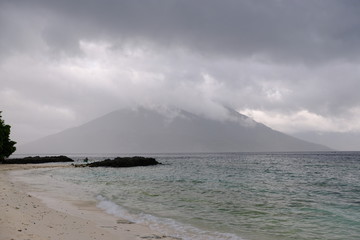 Indonesia Alor - beach and vulcano in background