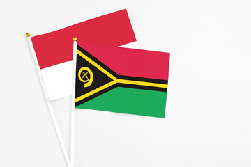 Vanuatu and Indonesia stick flags on white background. High quality fabric, miniature national...