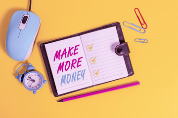 Word writing text Make More Money. Business photo showcasing Increase your incomes salary benefits Work harder Ambition Locked diary sheets clips marker mouse alarm clock colored background