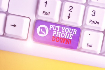 Writing note showing Put Your Phone Down. Business concept for end telephone connection saying goodbye caller White pc keyboard with note paper above the white background