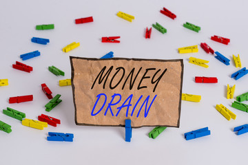 Handwriting text writing Money Drain. Conceptual photo To waste or squander money Spend money foolishly or carelessly Colored clothespin papers empty reminder white floor background office