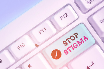 Conceptual hand writing showing Stop Stigma. Concept meaning end the feeling of disapproval that...