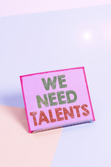 Word writing text We Need Talents. Business photo showcasing new recruitment Making interviews Choose creative showing Paper placed tilted above buffer wire on soft pastel multi colours backdrop