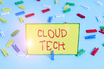 Word writing text Cloud Tech. Business photo showcasing storing and accessing data and programs over the Internet Colored clothespin papers empty reminder blue floor background office pin