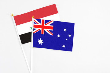 Australia and Iraq stick flags on white background. High quality fabric, miniature national flag....