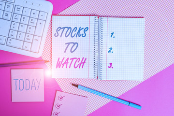 Handwriting text writing Stocks To Watch. Conceptual photo being heavy broker and watch every increase decrease Writing equipments and computer stuffs placed above colored plain table