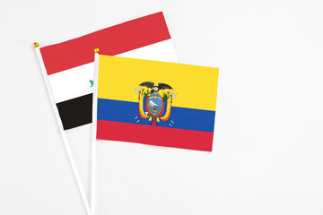 Ecuador and Iraq stick flags on white background. High quality fabric, miniature national flag....
