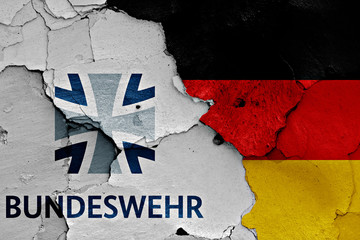 flags of Bundeswehr and Germany painted on cracked wall