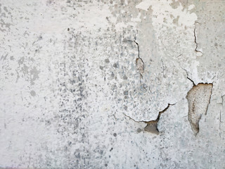 Obraz premium Close up White floor broken and white floor peeling along the wall flap for background.
