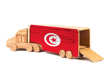 Close-up of a wooden toy truck with a painted national flag Tunisia. The concept of export-import,transportation, national delivery of goods