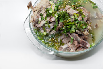 Hot and spicy pork spare rib soup with tamarind and Thai herbs in bowl, Hot and sour soup.