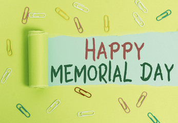 Writing note showing Happy Memorial Day. Business concept for Honoring Remembering those who died in military service Paper clip and torn cardboard on wood classic table backdrop