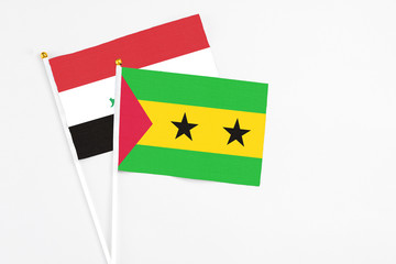 Sao Tome And Principe and Iraq stick flags on white background. High quality fabric, miniature national flag. Peaceful global concept.White floor for copy space.