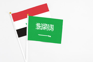 Saudi Arabia and Iraq stick flags on white background. High quality fabric, miniature national...