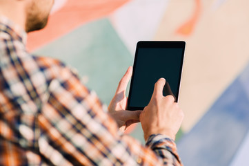 Man using  touching digital tablet , text messages, video calls, holidays to work, using the Internet