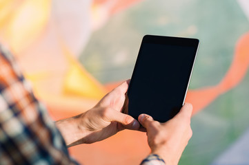 Man using  touching digital tablet , text messages, video calls, holidays to work, using the Internet