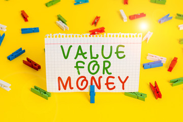 Handwriting text Value For Money. Conceptual photo reference to something is well worth the money spent on it Colored clothespin papers empty reminder yellow floor background office