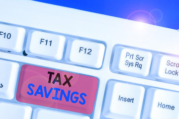 Conceptual hand writing showing Tax Savings. Concept meaning only a portion of income is taxable...