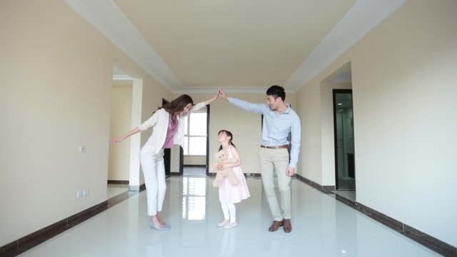 Happy young family in their new house,HD