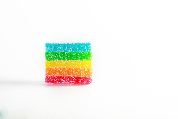 large rainbow chewing candy on white background