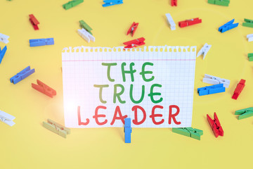Handwriting text The True Leader. Conceptual photo one that move and encourage group of showing Responsibility Colored clothespin papers empty reminder yellow floor background office