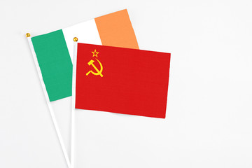 Soviet Union and Ireland stick flags on white background. High quality fabric, miniature national flag. Peaceful global concept.White floor for copy space