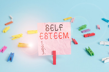 Handwriting text Self Esteem. Conceptual photo a feeling of having respect for yourself and your abilities Colored clothespin rectangle square shaped paper light blue background