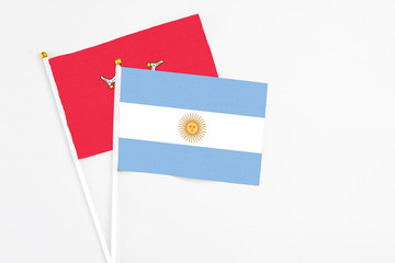 Argentina and Isle Of Man stick flags on white background. High quality fabric, miniature national...